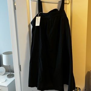 Black swing dress with bow tie back. Brand new with tags.